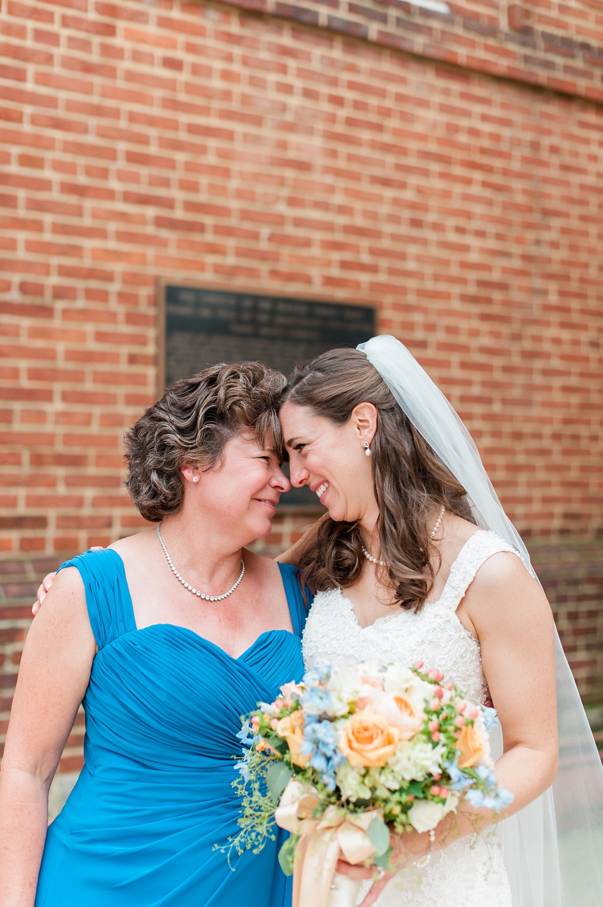 A beautiful, classic gold and indigo wedding with pops of peach at St. Mary's Church in Annapolis by Maryland Fine Art Wedding Photographer Lauren R Swann
