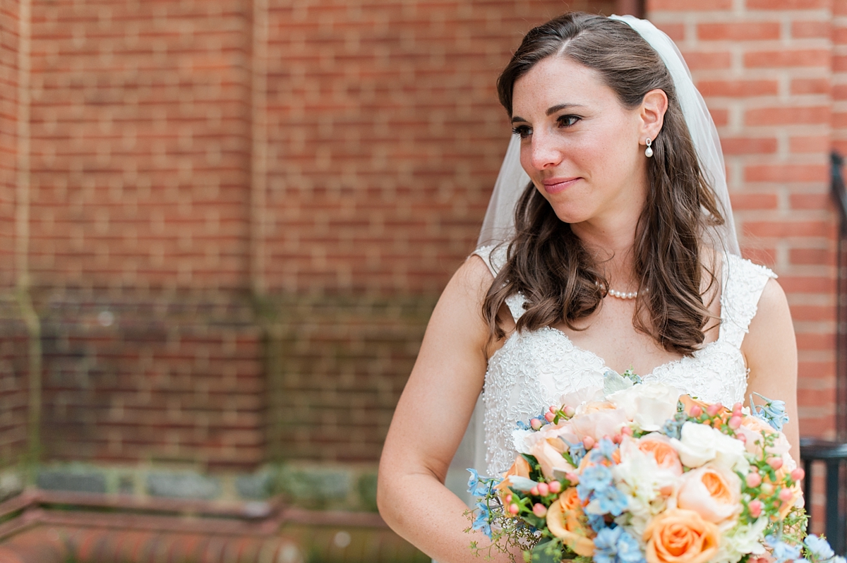 A beautiful, classic gold and indigo wedding with pops of peach at St. Mary's Church in Annapolis by Maryland Fine Art Wedding Photographer Lauren R Swann