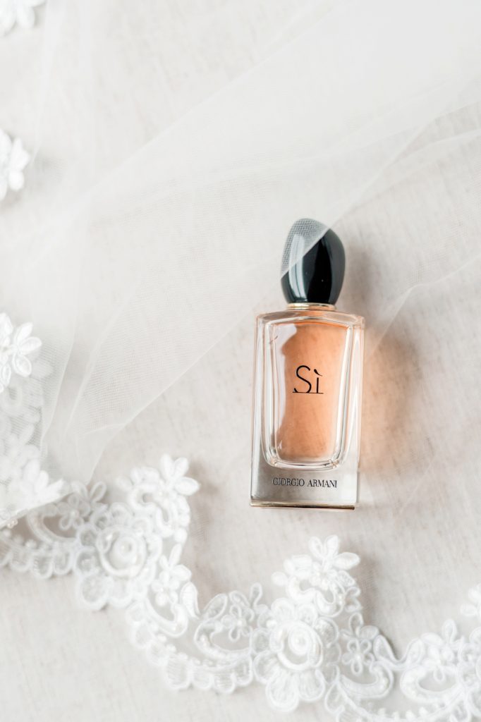 The perfect bridal details - perfume paired with a gorgeous veil for a coastal wedding.