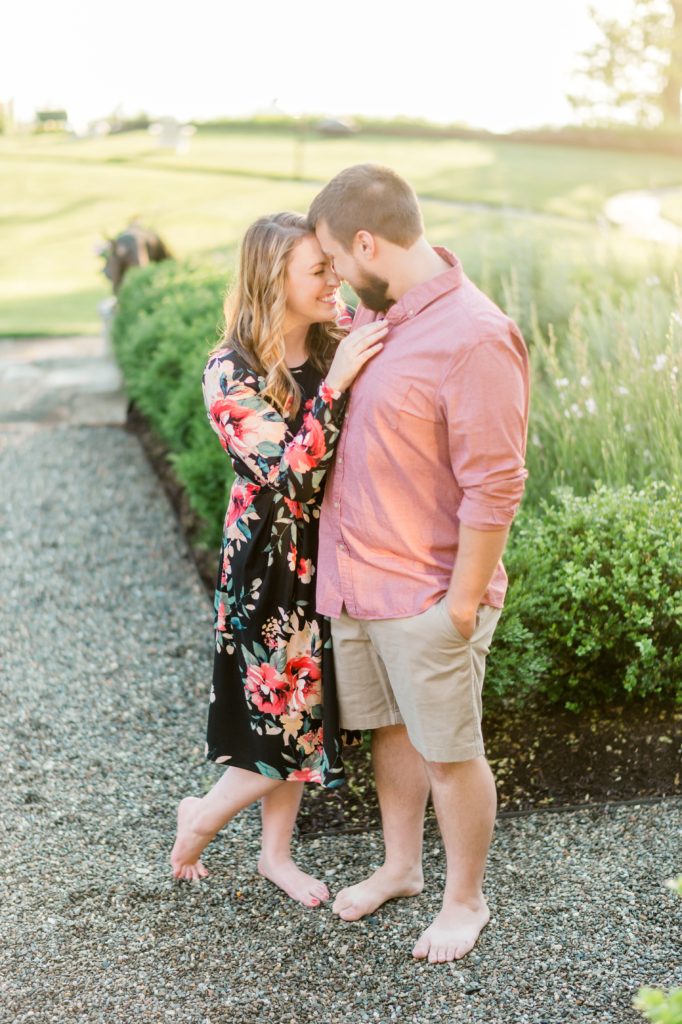 A beautiful Lake Shore Maryland Anniversary session with Natalie Franke and her husband, featuring golden light, perfect outfits, and stunning backdrops! Capture by Fine Art Wedding Photographer Lauren R Swann.