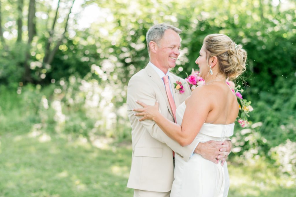 First Look | An Intimate Oatlands Plantation garden wedding featuring bold citrus colors photo