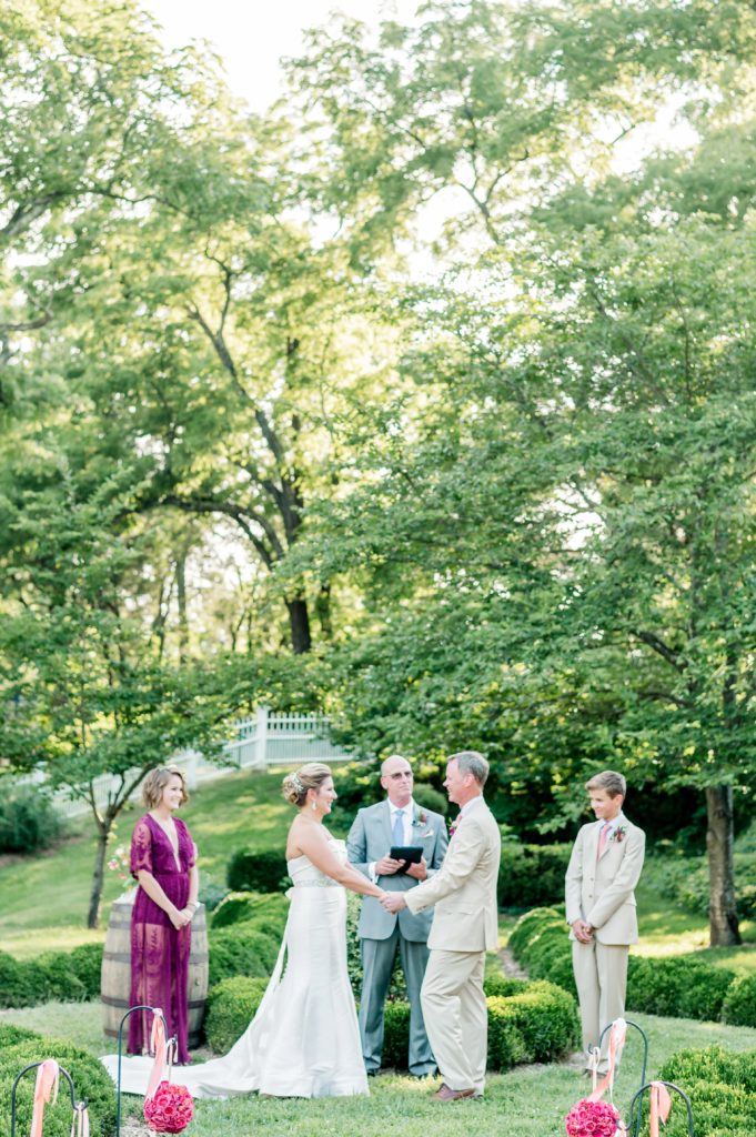Ceremony | An Intimate Oatlands Plantation garden wedding featuring bold citrus colors photo