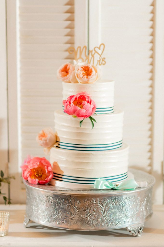 A Preppy Wedding Cake with Pink Peonies photo