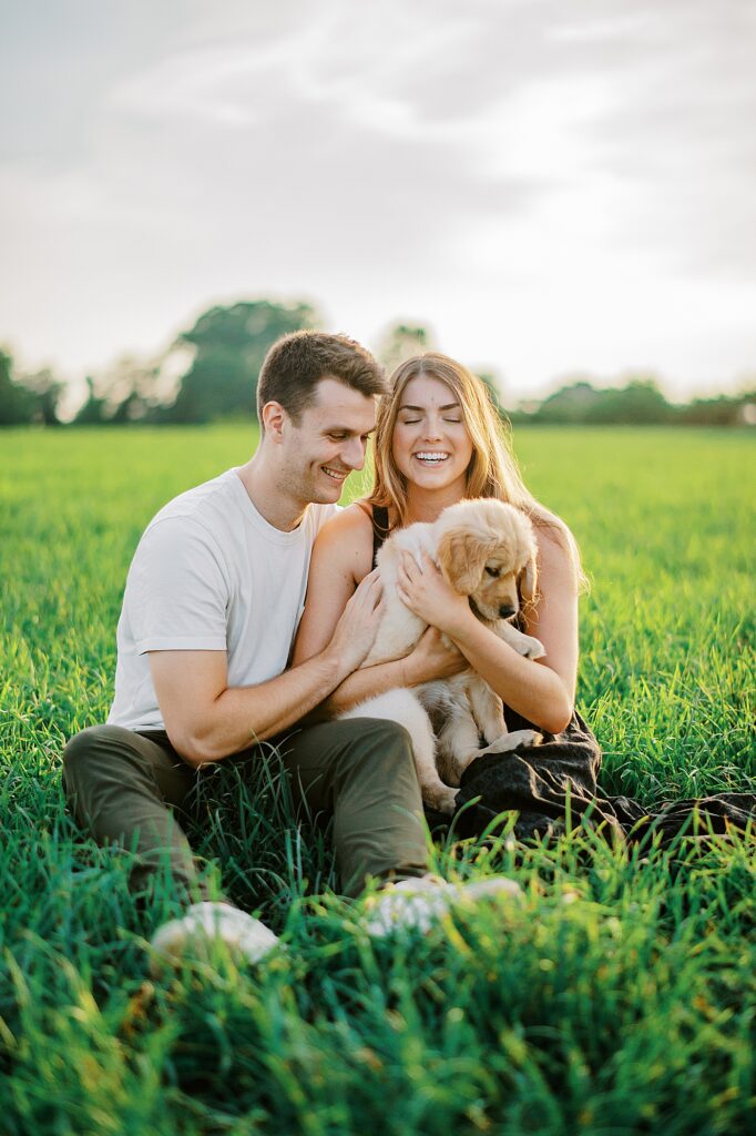 DC spring engagement portraits featuring an adorable golden retriever puppy.