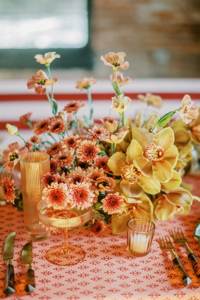 Luxury fall wedding tablescape formula from a DC wedding photographer. Patterned linens, candlelight, florals, and elevated reception details designed to photograph beautifully and feel timeless.