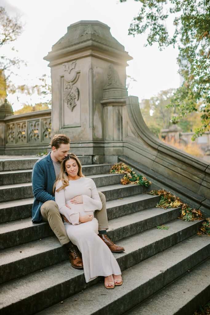 Autumn maternity photography in Central Park with warm fall colors.