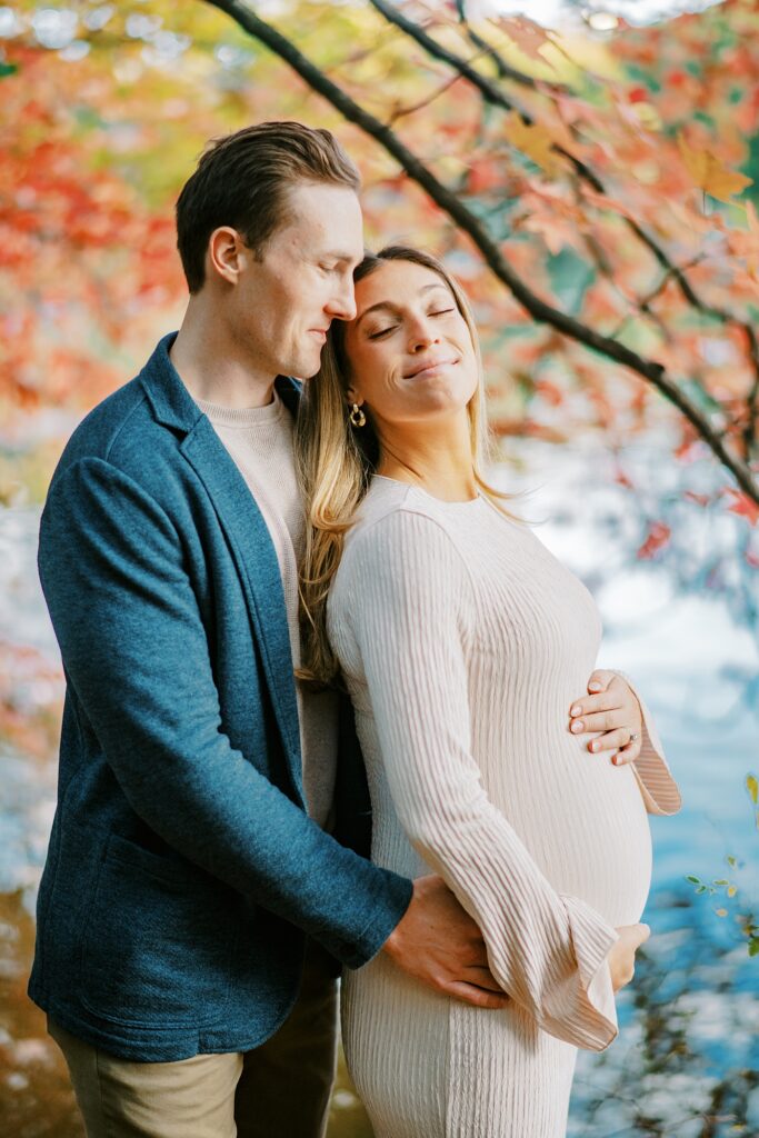 Autumn maternity photography in Central Park with warm fall colors.